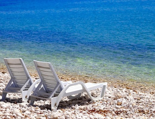 stock-photo-two-deck-chairs-on-beach-in-sunny-autumn-day-mediterranean-sea-turkey-466477382